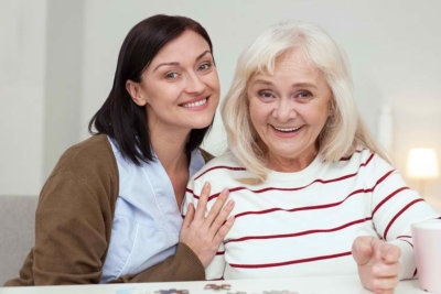 two woman smilling