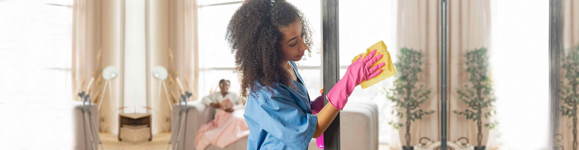 woman wiping the glass